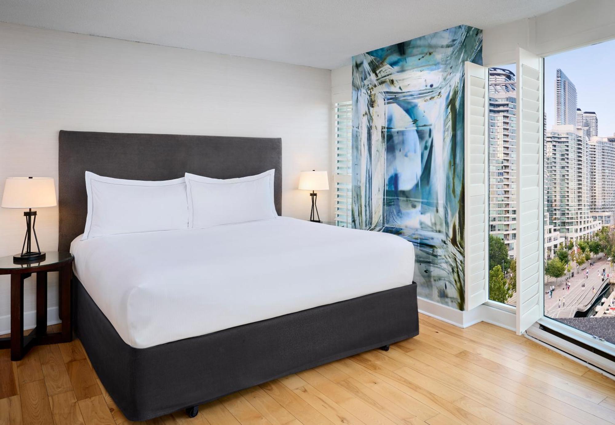 Suite con cama extragrande y vistas al puerto - No fumadores