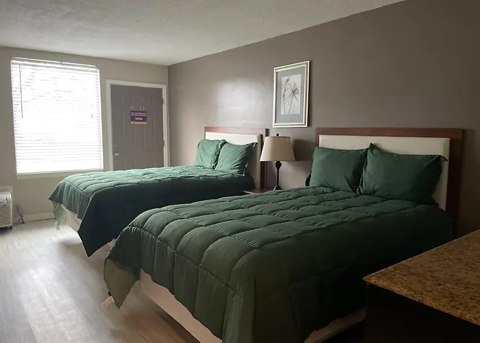 Apm Inn & Suites